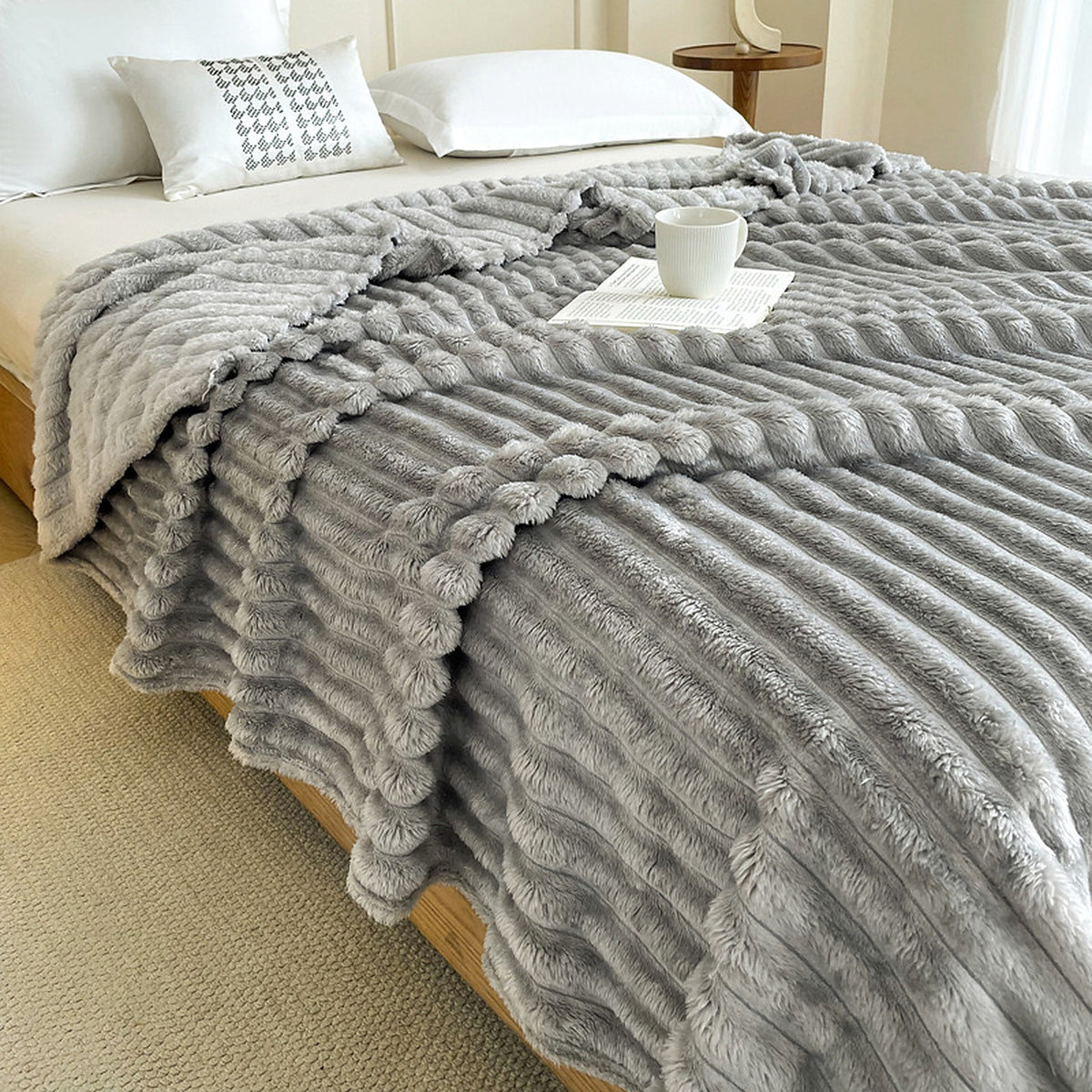 Lunvane Signature Oversized Blanket in Soft Grey styled across a bright bed