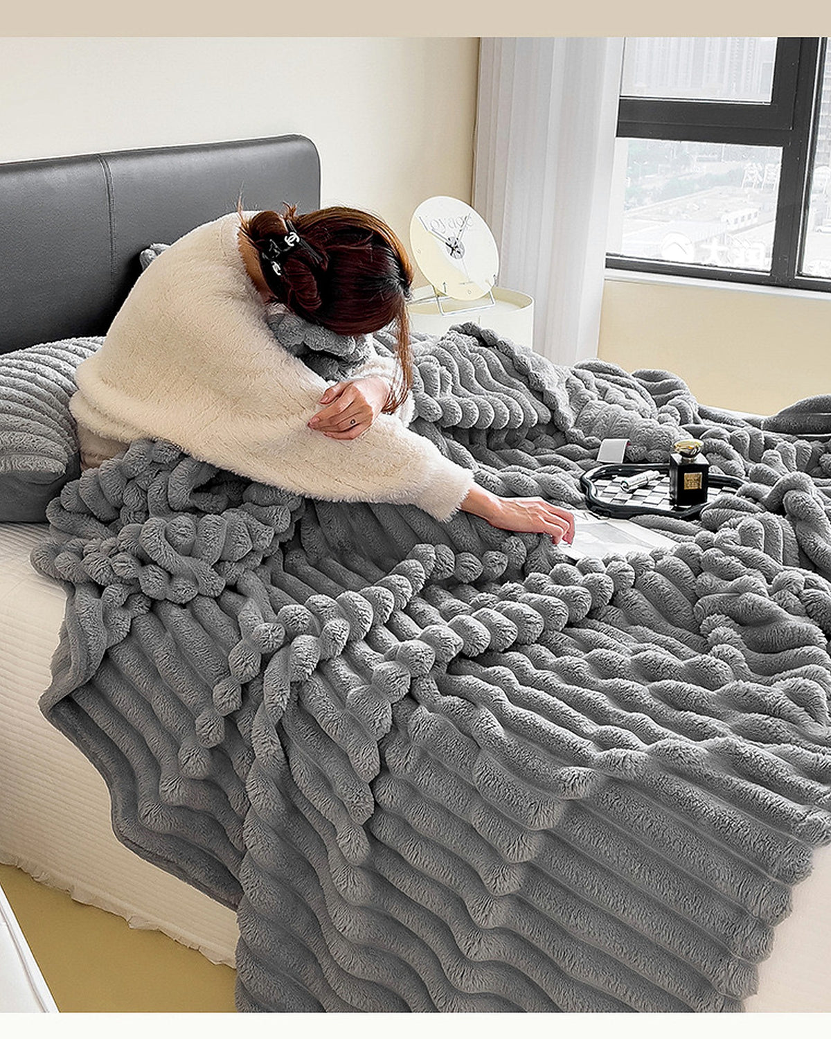 Lunvane Signature Oversized Blanket in Soft Grey shown in real use on a bed